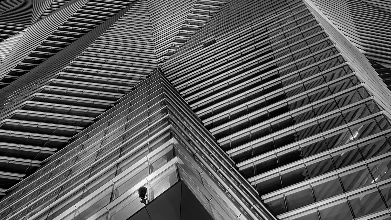 Modern architectural facade with layered geometric forms in black and white