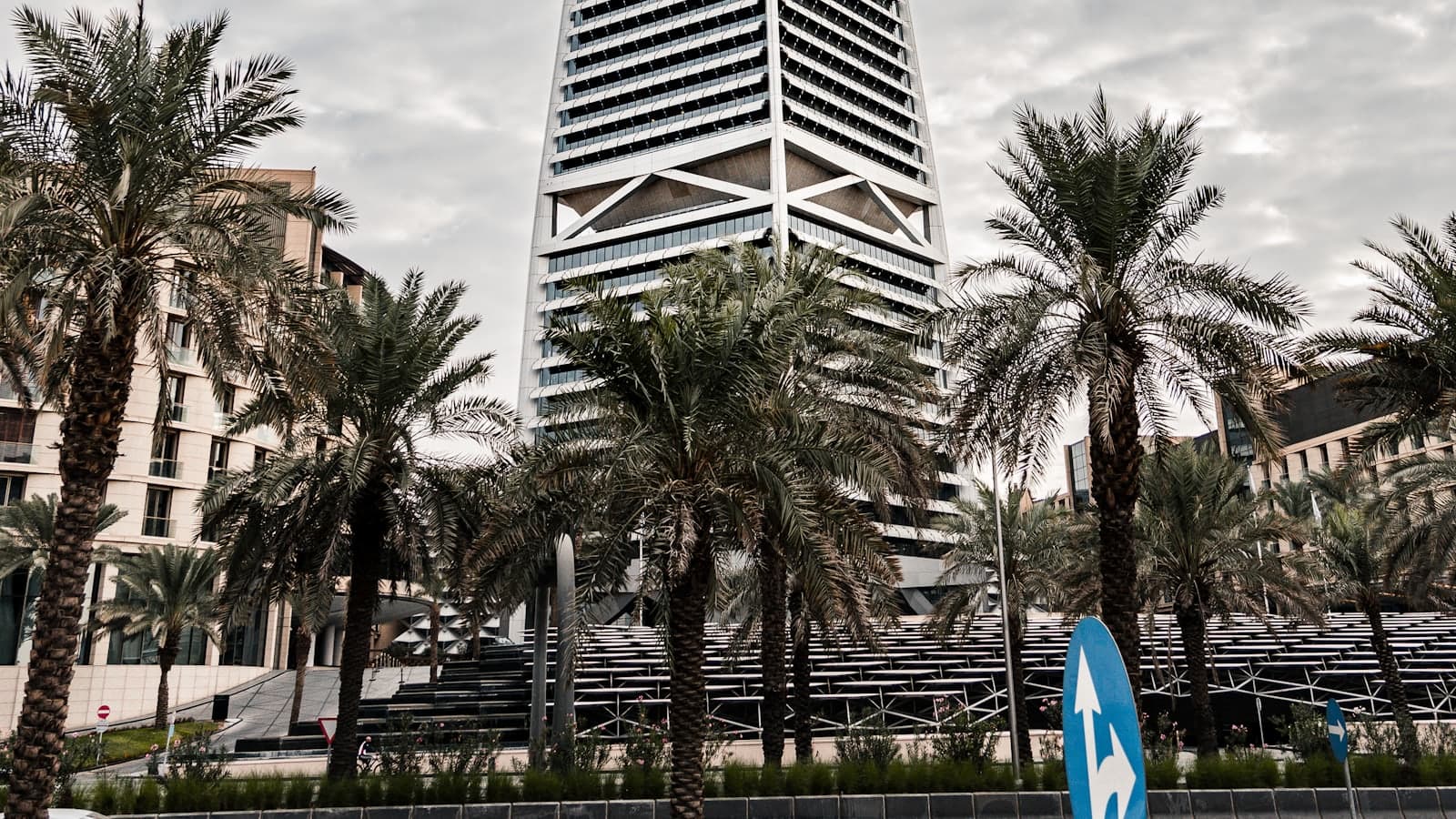 Al Faisaliah Tower in Riyadh with its geometric apex under a cloudy sky